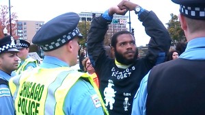 A protester face offs with police during a demonstration against the International Association of Chiefs of Police conference held last October in Chicago.