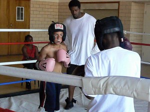 Thaddeus Carter get read for a practice sparring match at the North Lawndale Boxing League 