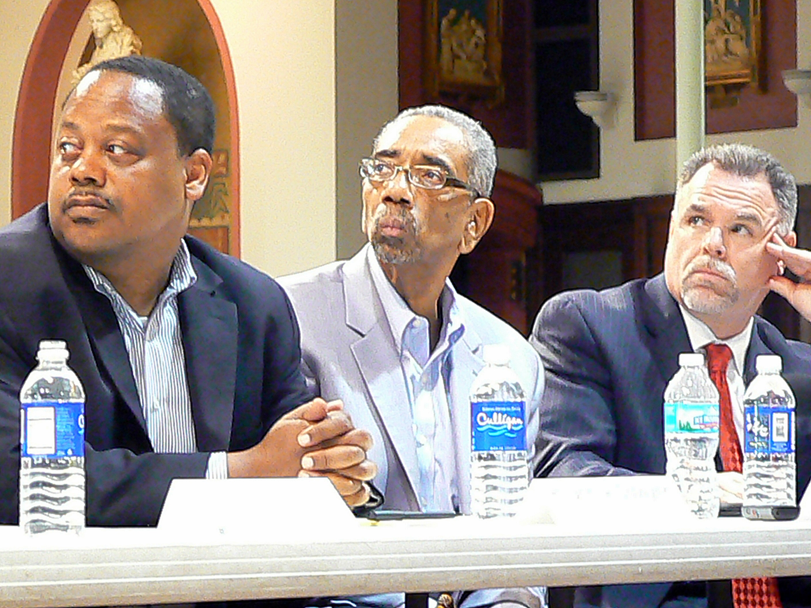 Sixth Ward Ald. Rod Sawyer, U.S. Congressman Bobby Rush, and Police Superindent Garry McCarthy listen to remarks from other law enforcement officials about reducing crime in Chatham.