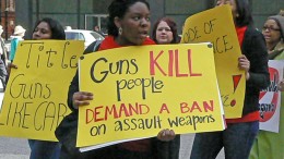 Marchers protest outside federal plaza in Chicago to demand tougher gun control legislation.